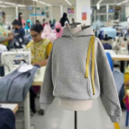 Finished pre production sample garment hanging in the factory showroom waiting for client fit sign off